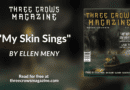 A banner advertising "My Skin Sings" by Ellen Meny on Three Crows Magazine